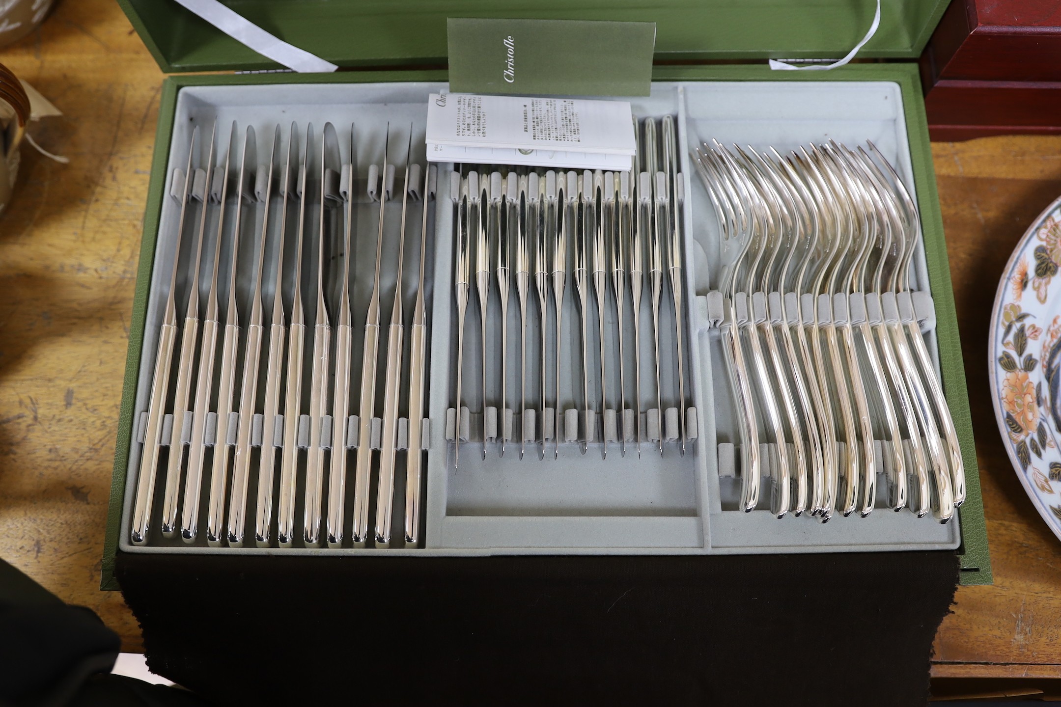 A Cristofle silver plated canteen of cutlery, comprising 84 items, in two trays.